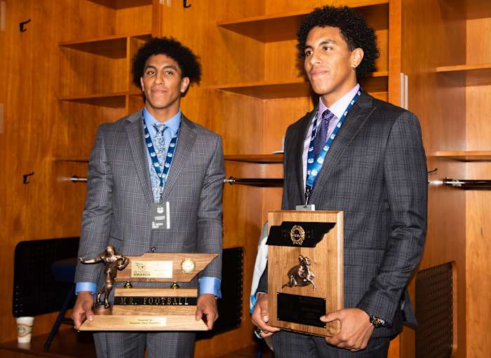 Summit Destin Wade holds the Class 6A Mr. Football award and Keaten Wade with the Mr. Football finalist, poses together in the Tennessee Titans locker room at Nissan Stadium in Nashville, Tenn., Tuesday, Dec. 7, 2021